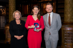 Theo Clarke holding her award for Best Political Speech of the Year, flanked by Dame Rosie Winterton and Pagefield's Oliver Foster